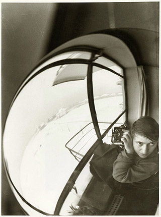 Marianne Brandt, Untitled (Self Portrait Reflected in a Globe in Bauhaus Atelier), 1928-29